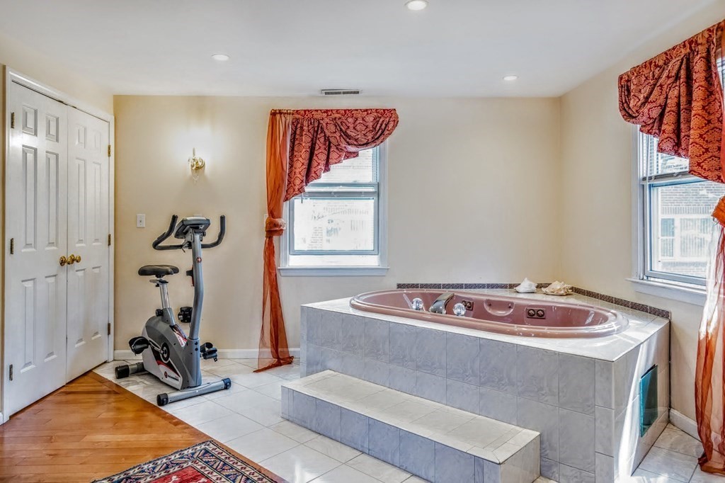 8 Spinney Path Lynn, MA 01902 - Photo 22 of 42 a room with gym equipment and windows