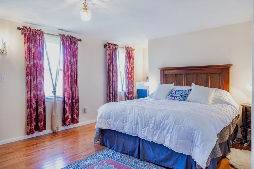 8 Spinney Path Lynn, MA 01902 - Photo 25 of 42 a bedroom with a large bed and a closet