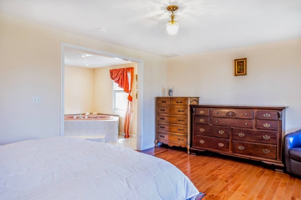 8 Spinney Path Lynn, MA 01902 - Photo 27 of 42 a bed room with a bed and a television