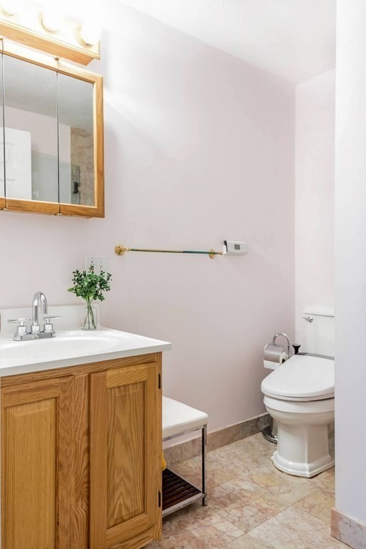 8 Spinney Path Lynn, MA 01902 - Photo 30 of 42 a bathroom with a sink toilet and a mirror