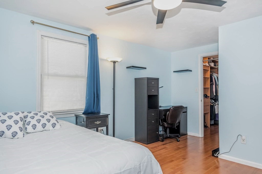 8 Spinney Path Lynn, MA 01902 - Photo 32 of 42 a bedroom with a bed and a table in it