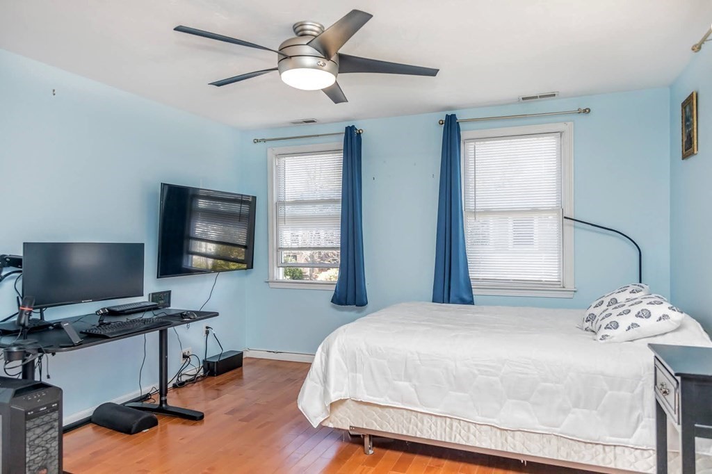 8 Spinney Path Lynn, MA 01902 - Photo 33 of 42 a bedroom with a bed window and a flat screen tv