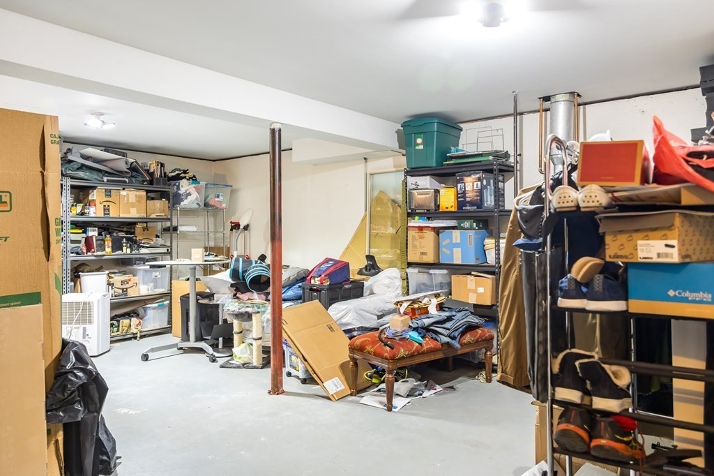 8 Spinney Path Lynn, MA 01902 - Photo 35 of 42 a living room with lots of furniture and a flat screen tv