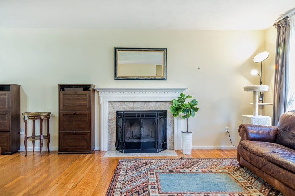 8 Spinney Path Lynn, MA 01902 - Photo 7 of 42 a living room with furniture and a fireplace