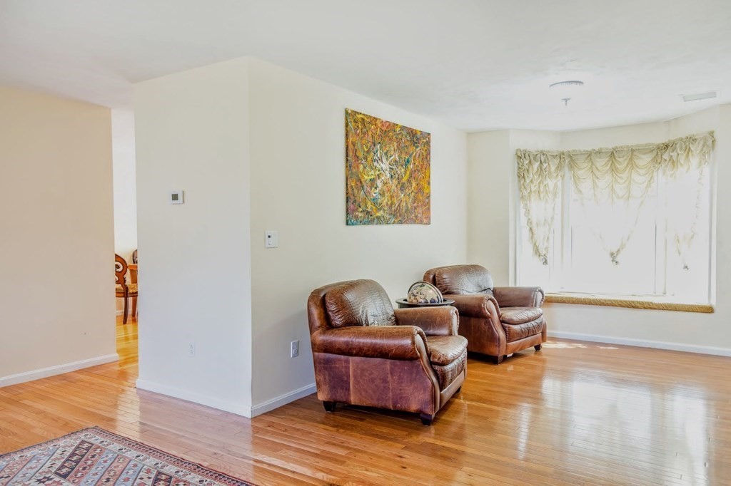 8 Spinney Path Lynn, MA 01902 - Photo 8 of 42 a living room with furniture and wooden floor