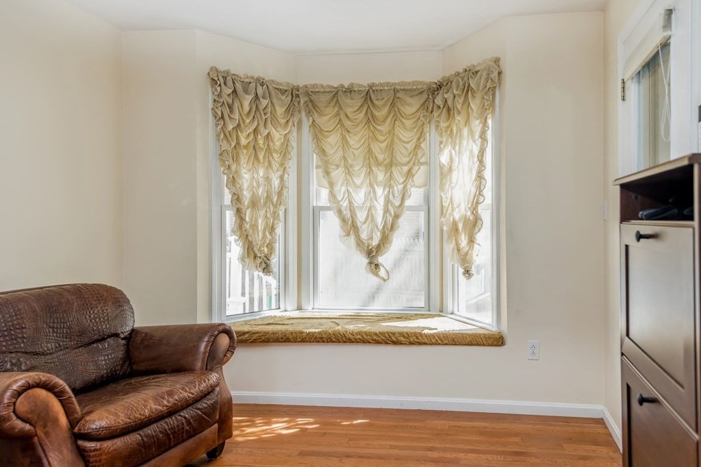8 Spinney Path Lynn, MA 01902 - Photo 9 of 42 a living room with furniture and a flat screen tv