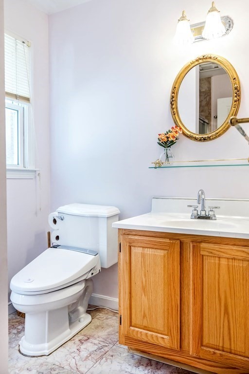 8 Spinney Path Lynn, MA 01902 - Photo 10 of 42 a bathroom with a toilet and a sink