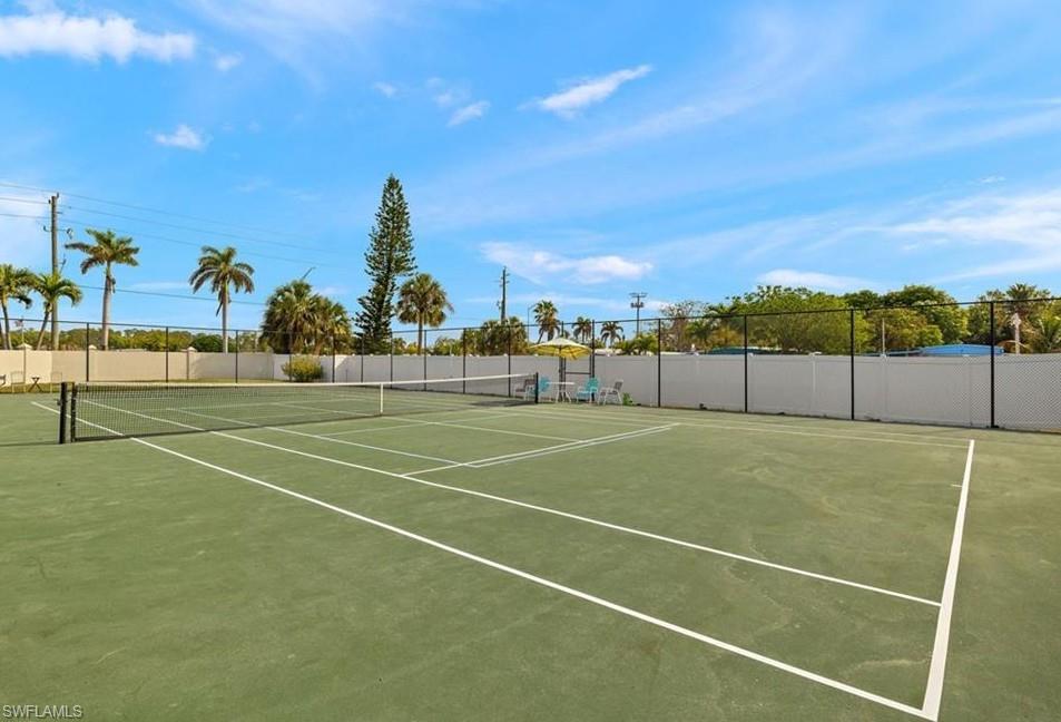 76 Atlantic Way, Unit 76 Naples, FL 34104 - Photo 8 of 18 View of tennis court featuring community basketball court