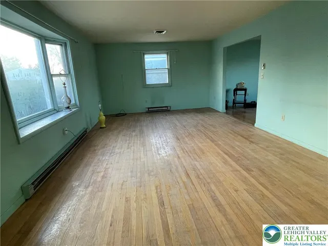 a view of an empty room and window