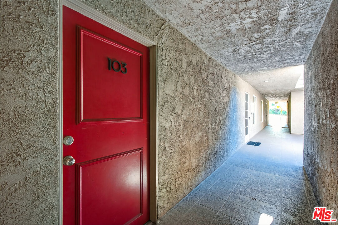 1125 Pico Boulevard, Unit 103 Santa Monica, CA 90405 - Photo 26 of 33 a view of a hallway with wooden floor