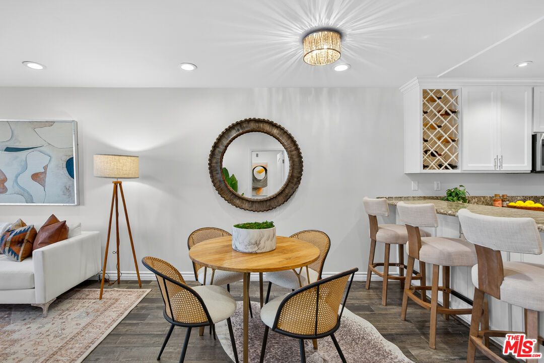 1125 Pico Boulevard, Unit 103 Santa Monica, CA 90405 - Photo 6 of 33 a view of a dining room with furniture and a table