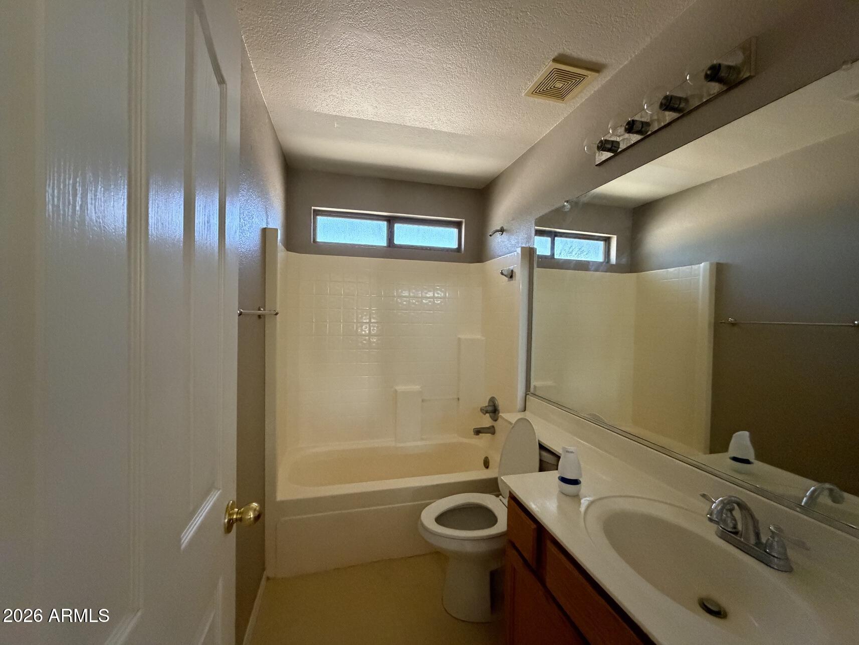 10807 West Monte Vista Road Avondale, AZ 85392 - Photo 24 of 33 a bathroom with a sink and a tub