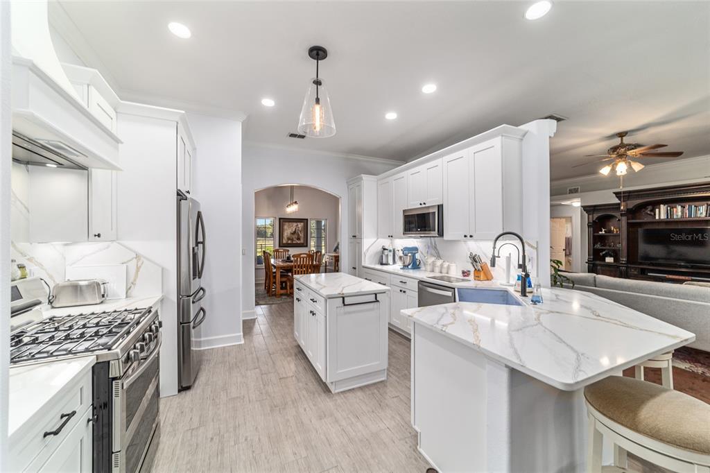 16050 Northwest 10th Circle Citra, FL 32113 - Photo 14 of 76 a open kitchen with stainless steel appliances granite countertop a sink stove and refrigerator