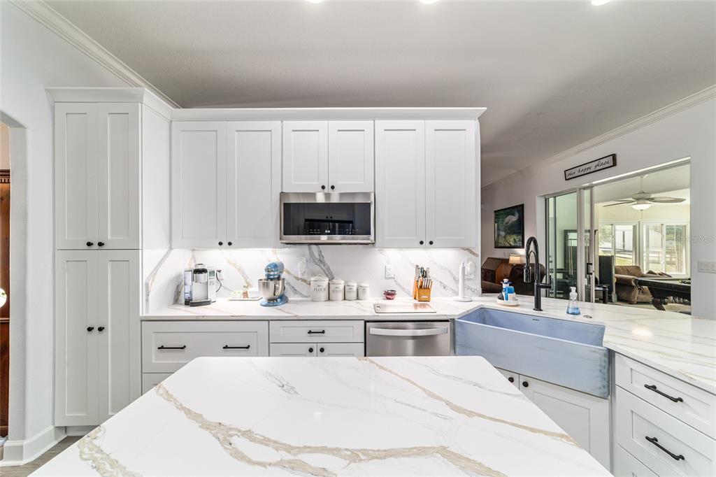 16050 Northwest 10th Circle Citra, FL 32113 - Photo 17 of 76 a kitchen with counter top space and cabinets