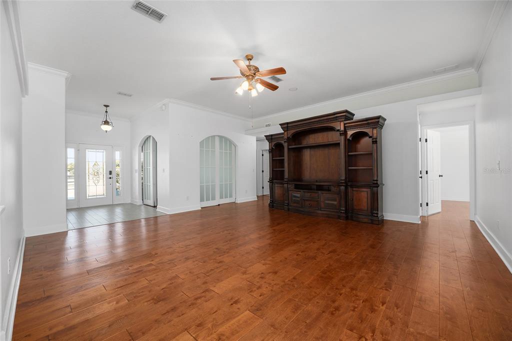16050 Northwest 10th Circle Citra, FL 32113 - Photo 19 of 76 a view of an empty room with a ceiling fan and window