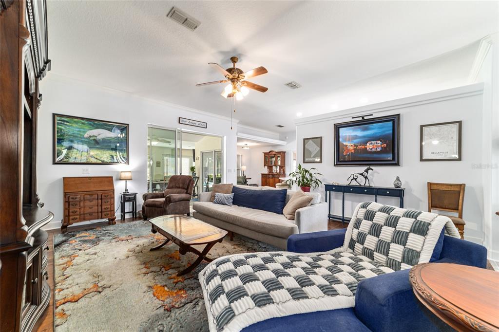 16050 Northwest 10th Circle Citra, FL 32113 - Photo 21 of 71 a living room with furniture a rug and a flat screen tv