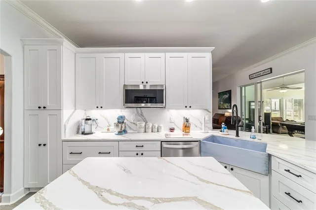 a bedroom with a bed window and walk in closet