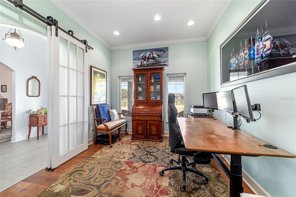 16050 Northwest 10th Circle Citra, FL 32113 - Photo 27 of 76 a workspace with furniture window and wooden floor