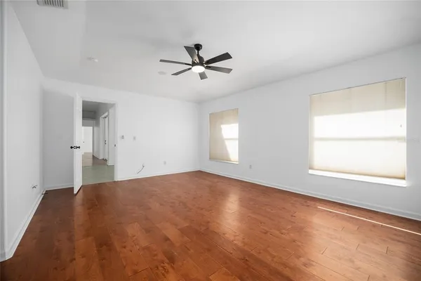 a view of a dining room with furniture wooden floor and chandelier