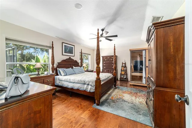 a bedroom with bed and window