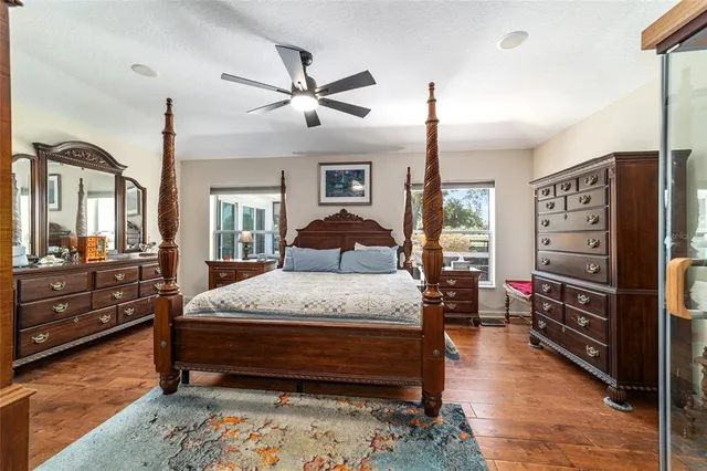 a view of a dining room with furniture wooden floor and chandelier