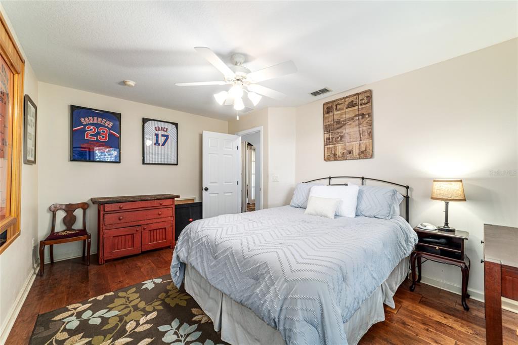 16050 Northwest 10th Circle Citra, FL 32113 - Photo 44 of 71 a bedroom with a bed and a chandelier