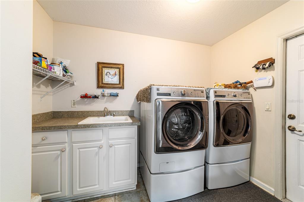 16050 Northwest 10th Circle Citra, FL 32113 - Photo 47 of 71 a utility room with sink dryer and washer