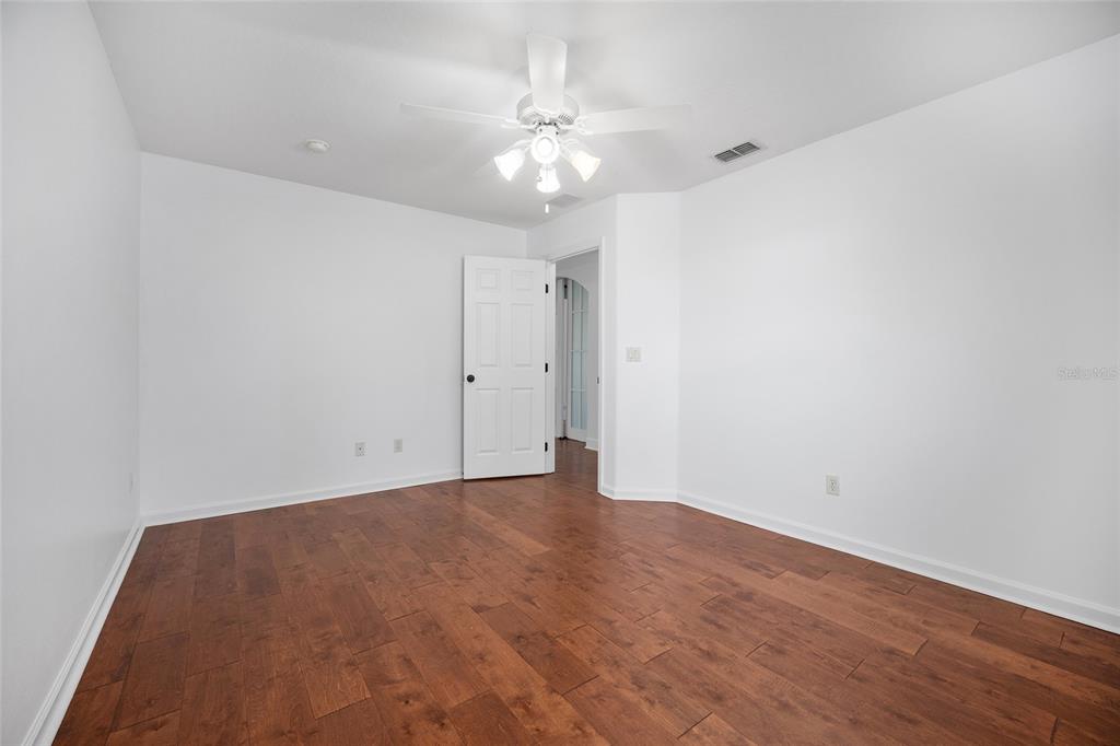 16050 Northwest 10th Circle Citra, FL 32113 - Photo 47 of 76 a view of an empty room with wooden floor
