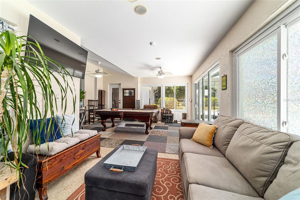 16050 Northwest 10th Circle Citra, FL 32113 - Photo 50 of 76 a living room with furniture and a large window