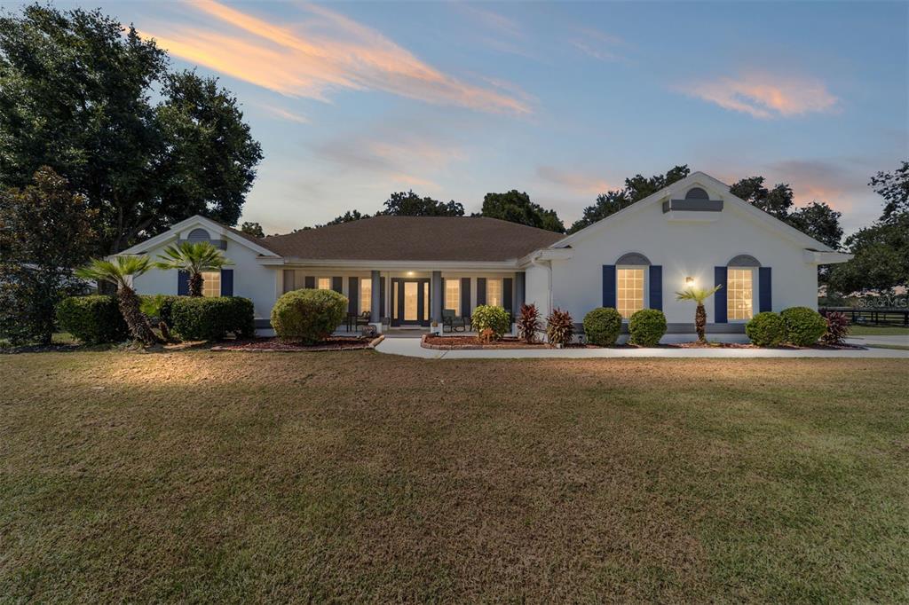 16050 Northwest 10th Circle Citra, FL 32113 - Photo 5 of 76 a front view of a house with a garden
