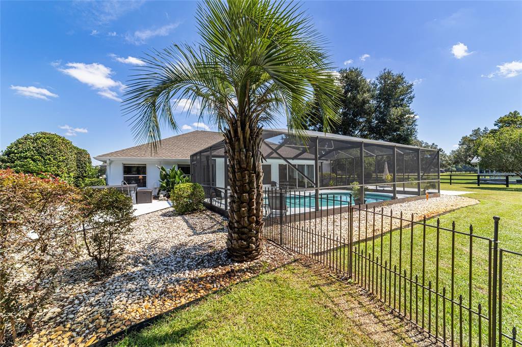 16050 Northwest 10th Circle Citra, FL 32113 - Photo 52 of 76 a view of a house with backyard and sitting area