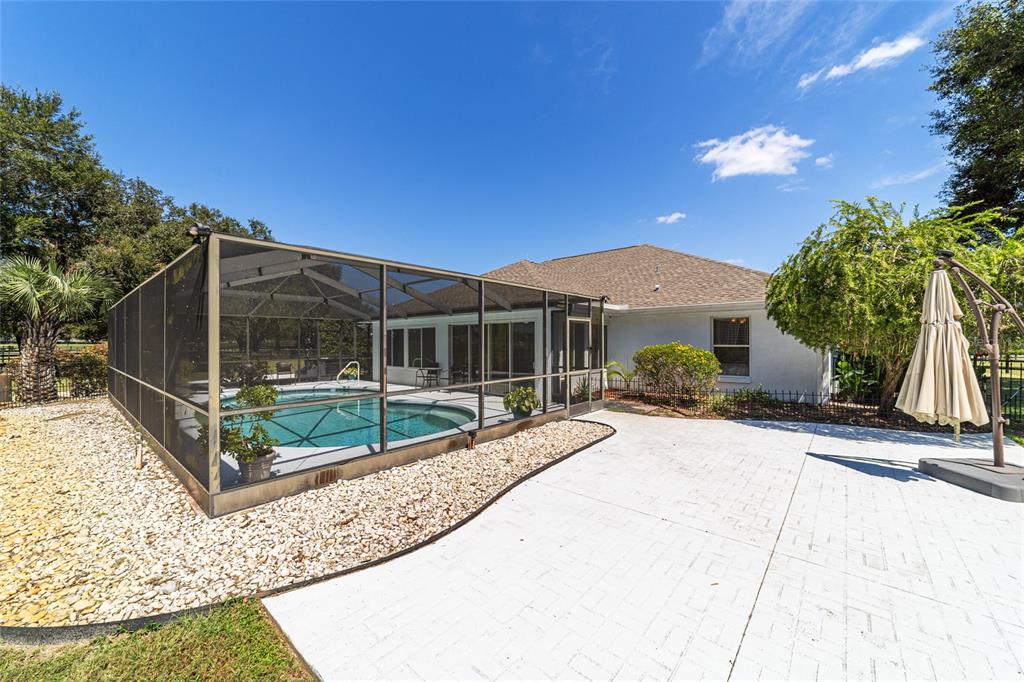 16050 Northwest 10th Circle Citra, FL 32113 - Photo 57 of 76 a view of a house with backyard and sitting area