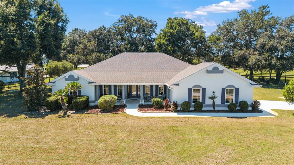 16050 Northwest 10th Circle Citra, FL 32113 - Photo 6 of 71 a front view of a house with a yard