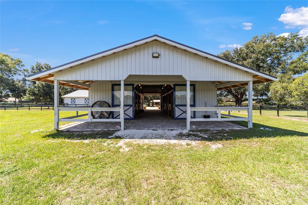 16050 Northwest 10th Circle Citra, FL 32113 - Photo 62 of 76 a view of a house with backyard and a patio