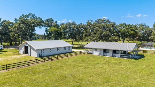 an aerial view of a house with swimming pool