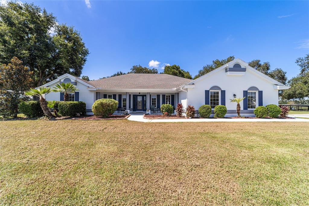 16050 Northwest 10th Circle Citra, FL 32113 - Photo 8 of 71 a front view of a house with a yard
