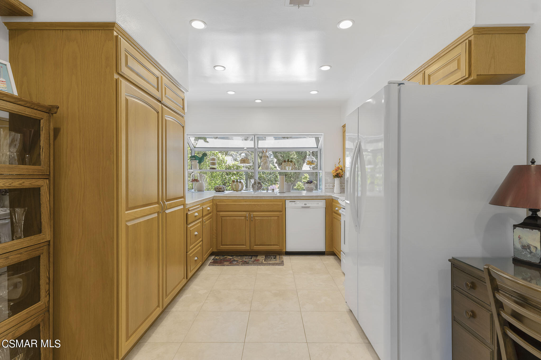2516 Clearfield Place Simi Valley, CA 93065 - Photo 11 of 39 a view of a kitchen with a refrigerator and microwave