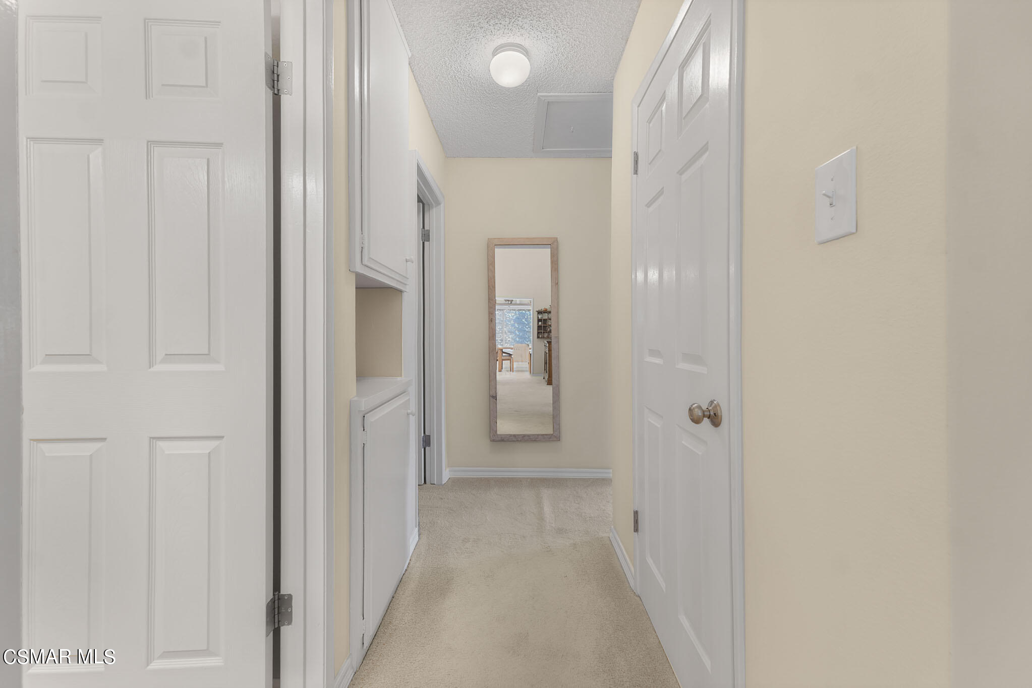 2516 Clearfield Place Simi Valley, CA 93065 - Photo 16 of 39 a view of a hallway with wooden shelves
