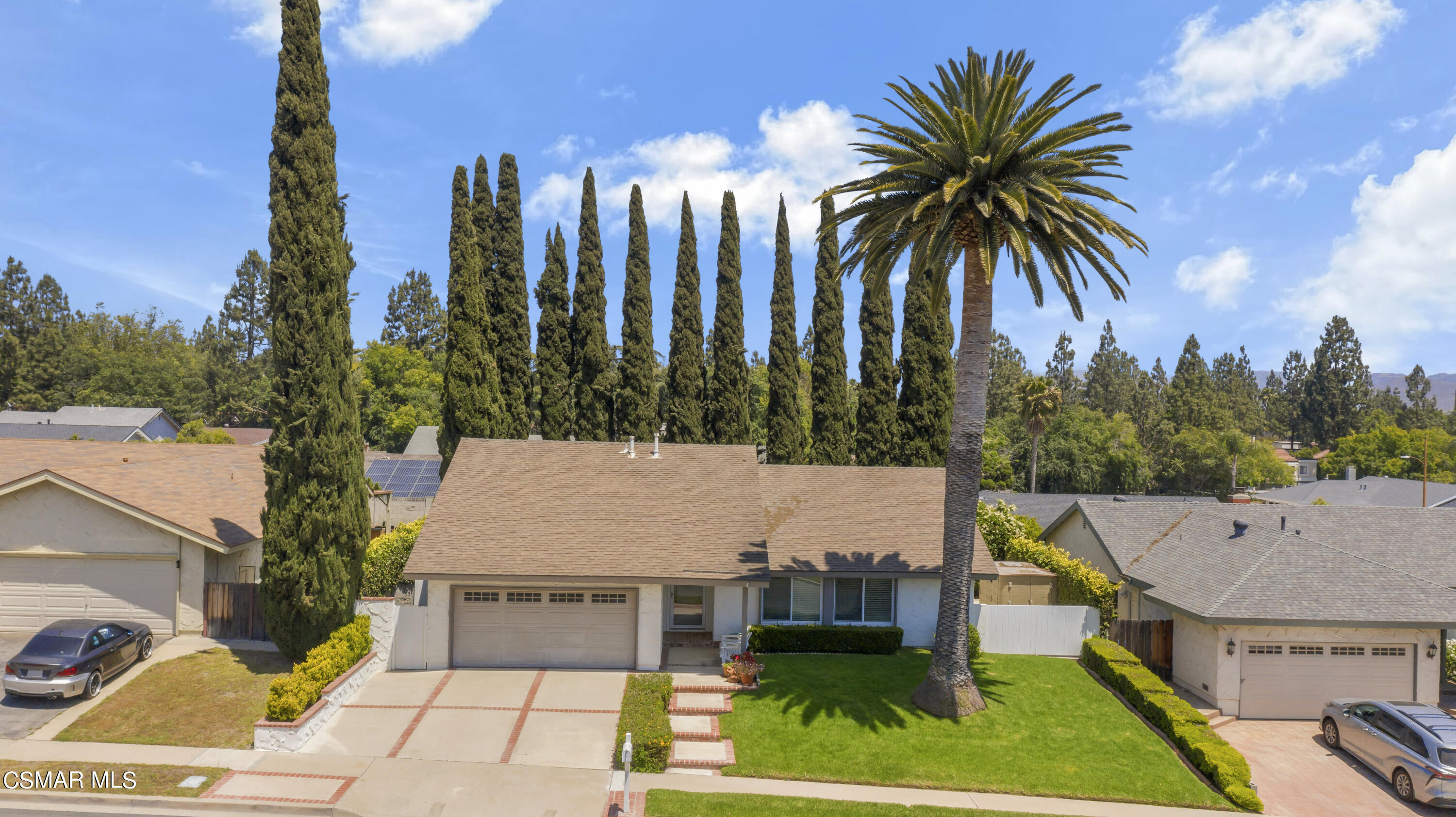 2516 Clearfield Place Simi Valley, CA 93065 - Photo 36 of 39 a view of a house with a swimming pool and a yard