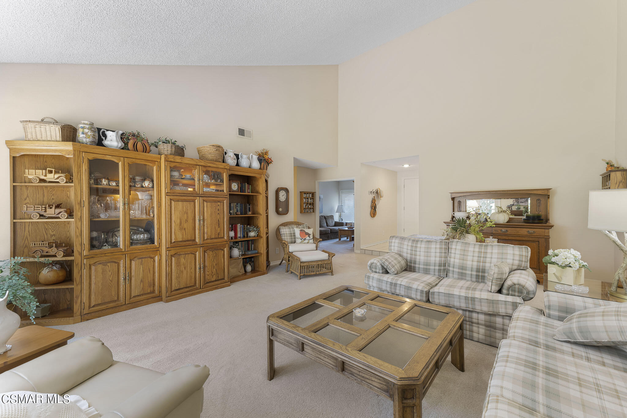 2516 Clearfield Place Simi Valley, CA 93065 - Photo 7 of 39 a living room with furniture a rug and white walls