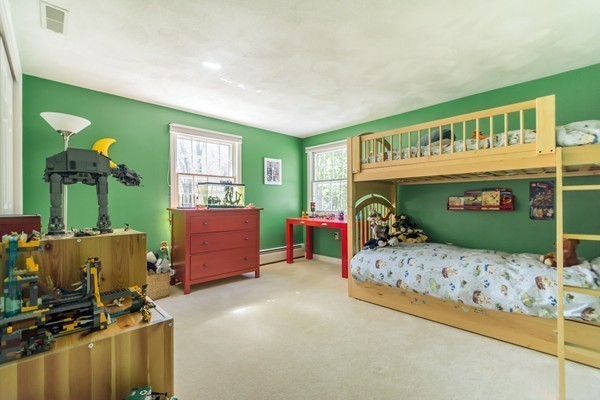 22 Blueberry Hill Road Andover, MA 01810 - Photo 17 of 30 a bedroom with a bed and a tv in it