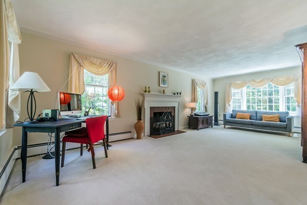 22 Blueberry Hill Road Andover, MA 01810 - Photo 3 of 30 a view of a livingroom with furniture and a fireplace