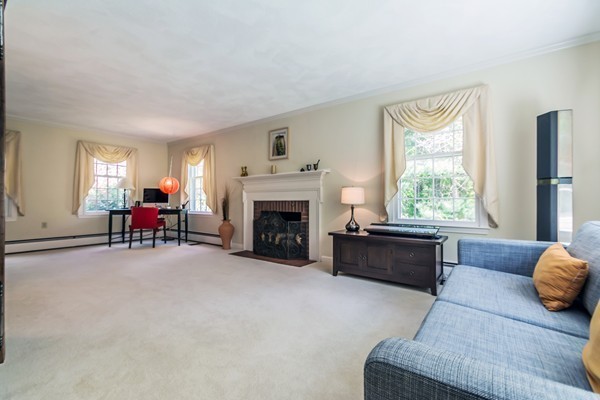 22 Blueberry Hill Road Andover, MA 01810 - Photo 4 of 30 a living room with furniture and a fireplace