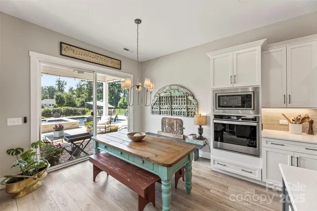 a view of a livingroom with furniture window and wooden floor