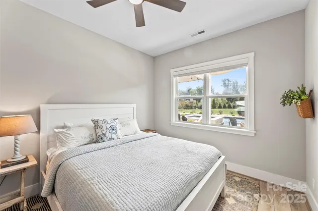 a bedroom with a large bed and a window