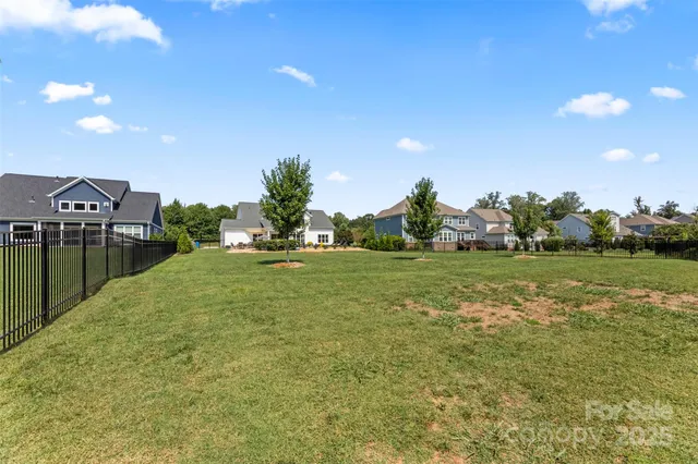 a view of a green field with clear sky