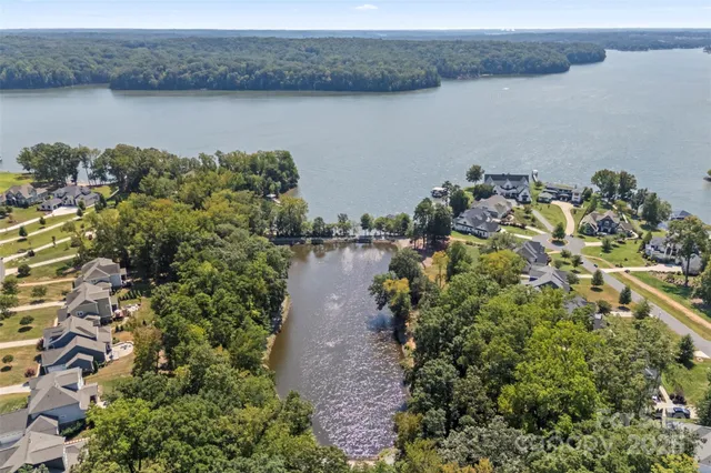 an aerial view of a house with a swimming pool