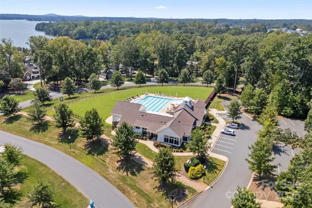 a swimming pool with lots of green space