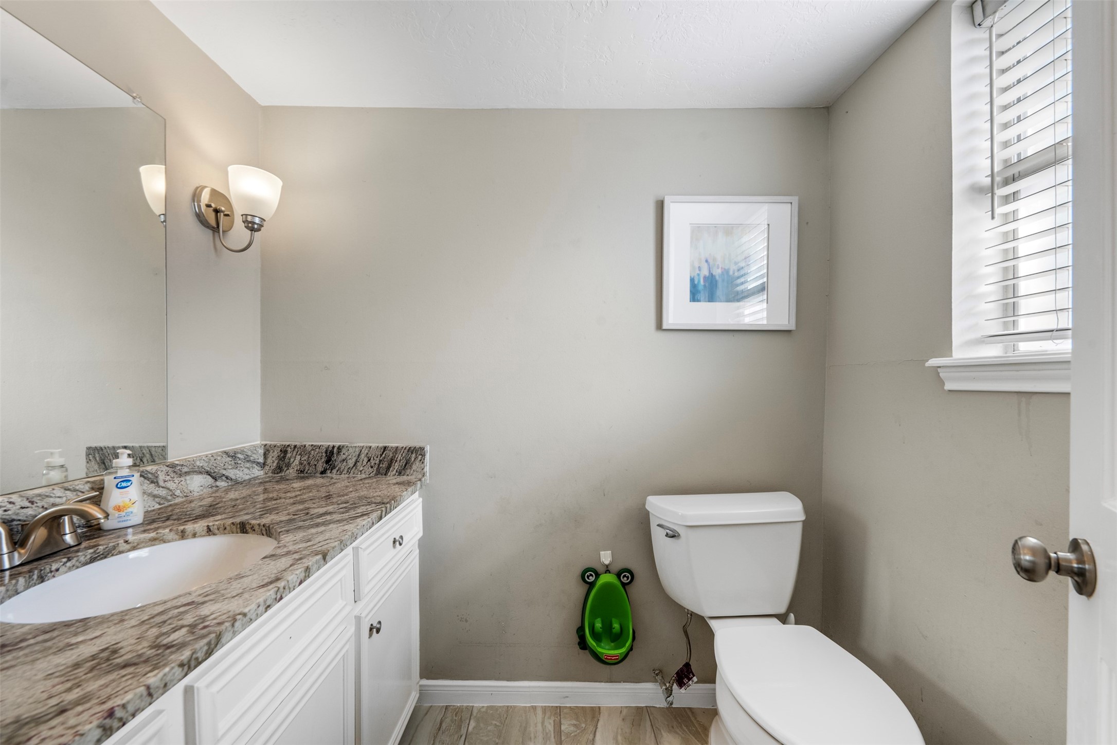 4223 Annawood Circle Spring, TX 77388 - Photo 11 of 30 a bathroom with a granite countertop toilet sink and mirror