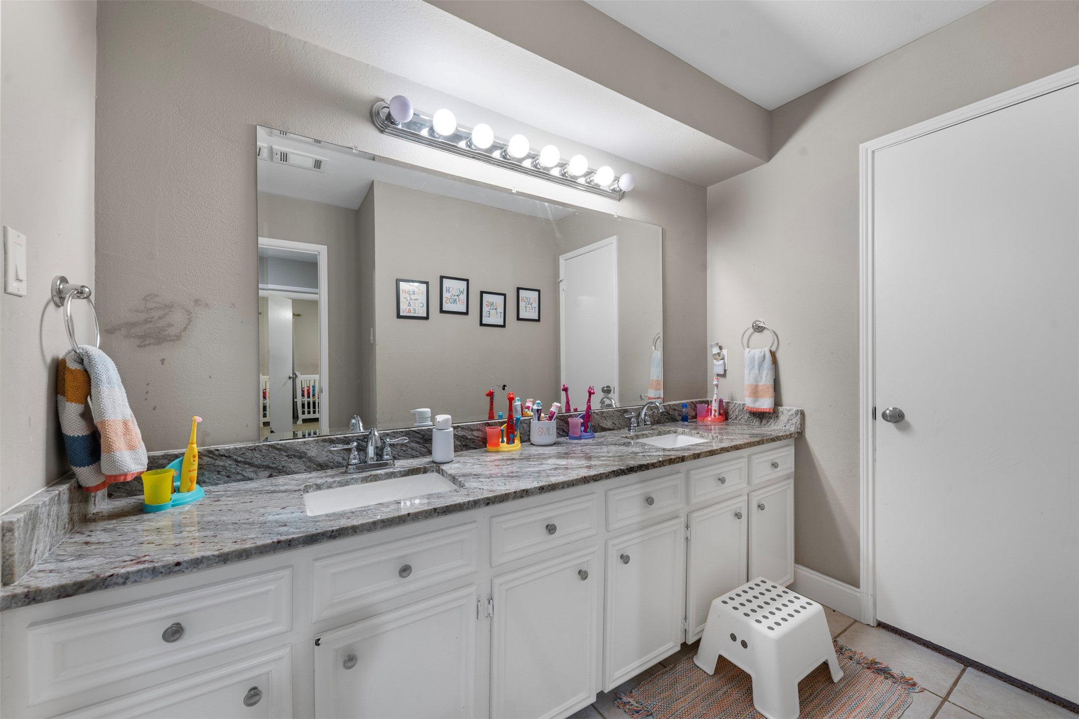 4223 Annawood Circle Spring, TX 77388 - Photo 14 of 30 a bathroom with a double vanity sink and a mirror